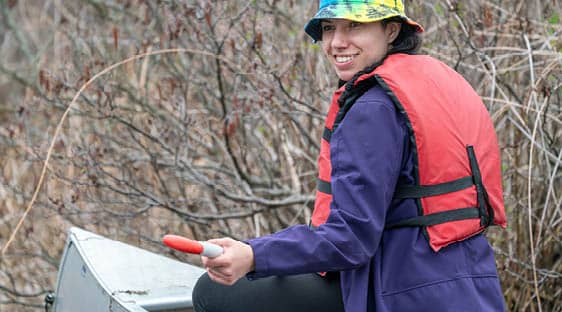 A Fish and Wildlife Technology student in a cannoe