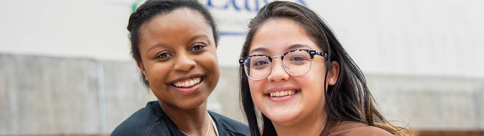 Two FLCC students standing outside main campus.