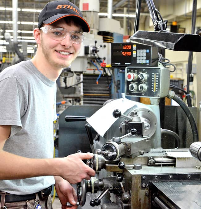 CPT student taking part in a skills assessment using manufacturing equipment