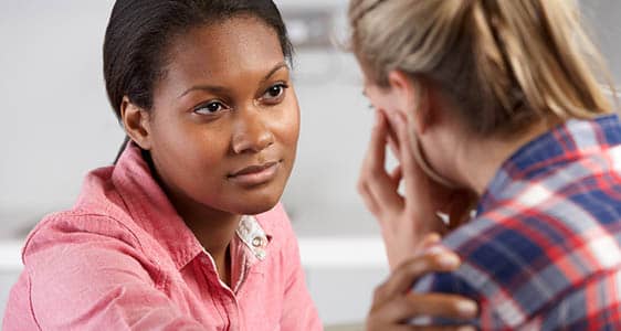 A counselor supporting a students in distress.